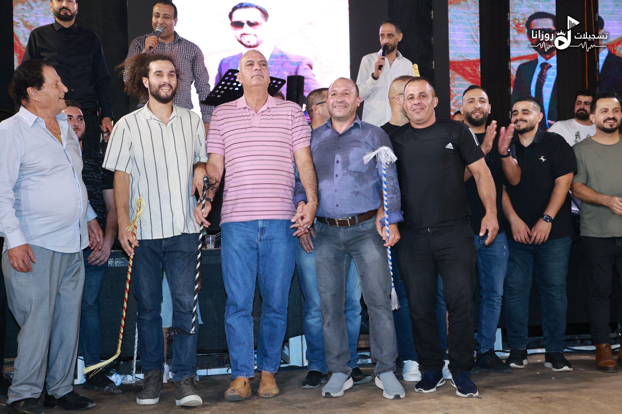 Street Dabka - Community gathering with traditional dabke canes