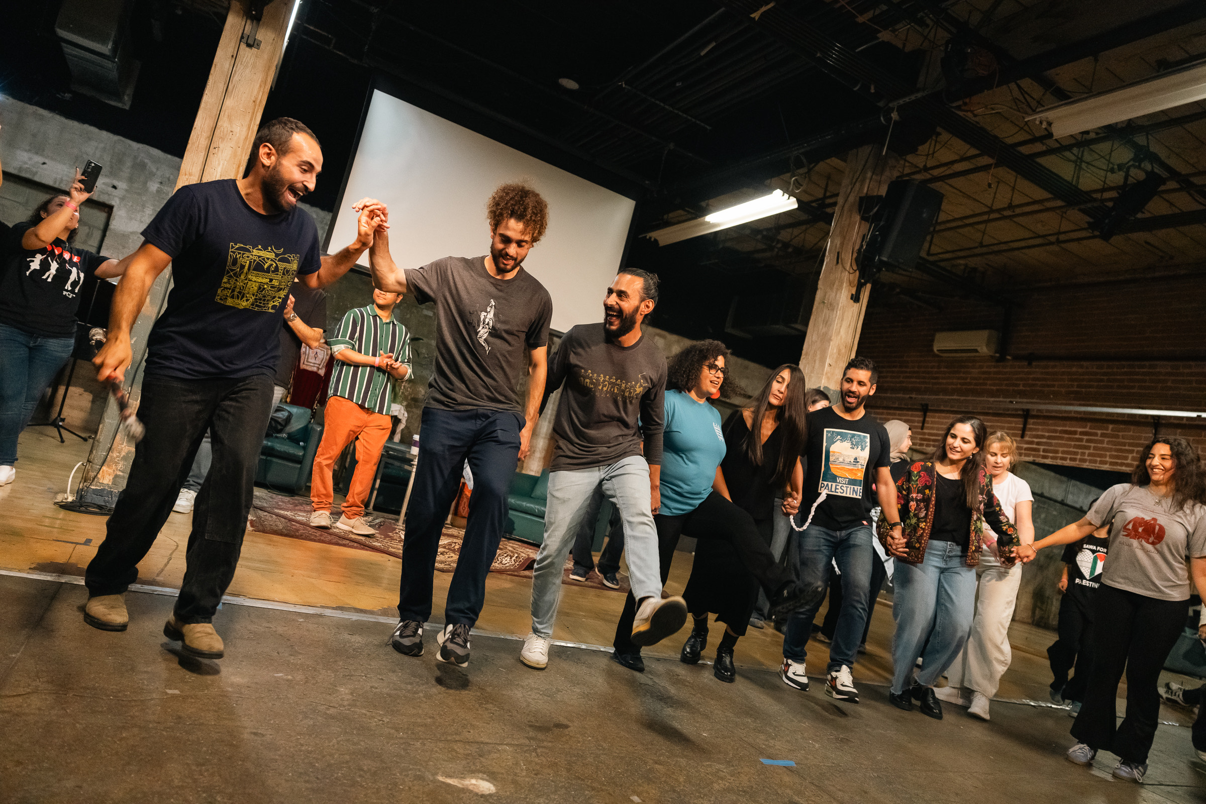 Community workshop with participants in line formation